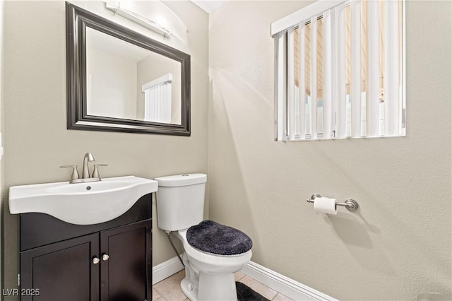 1287 Dove Tree Ct, Henderson, NV 89014 - half bath featuring toilet, baseboards, tile patterned floors, and vanity