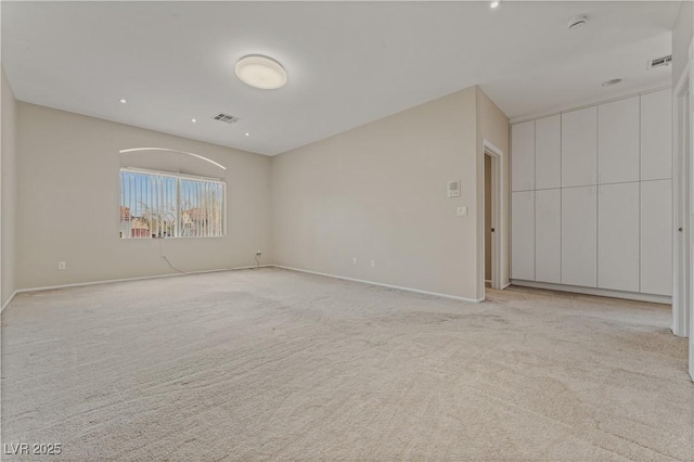 1287 Dove Tree Ct, Henderson, NV 89014 - spare room with light carpet, baseboards, and visible vents