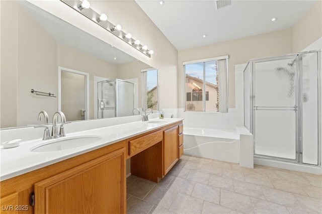 1287 Dove Tree Ct, Henderson, NV 89014 - full bathroom featuring a shower stall, a bath, double vanity, and a sink