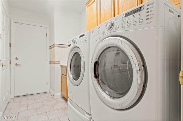 1287 Dove Tree Ct, Henderson, NV 89014 - laundry room featuring light tile patterned floors, separate washer and dryer, and cabinet space