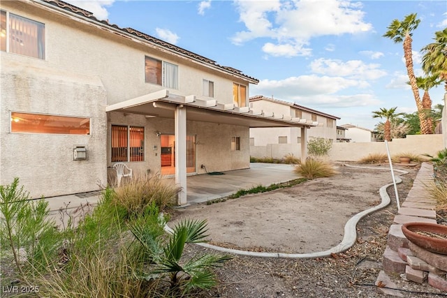 1287 Dove Tree Ct, Henderson, NV 89014 - rear view of house with a patio area, stucco siding, and a fenced backyard