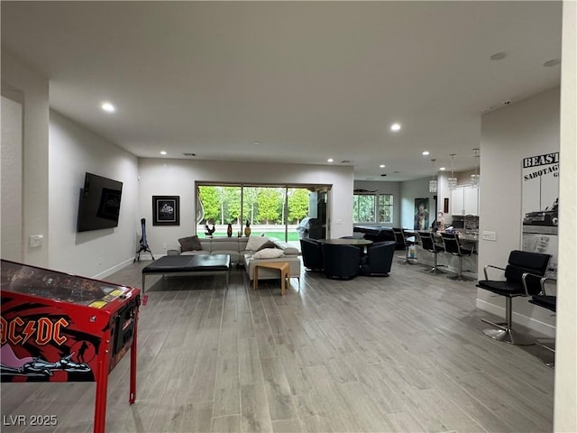 living room featuring recessed lighting and wood finished floors