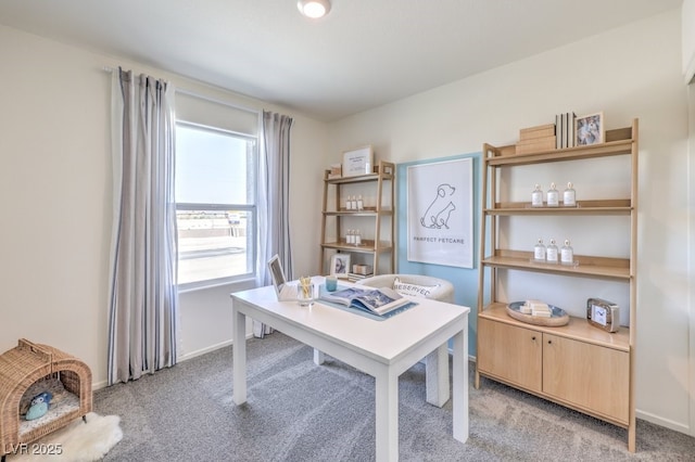 home office with light colored carpet and baseboards