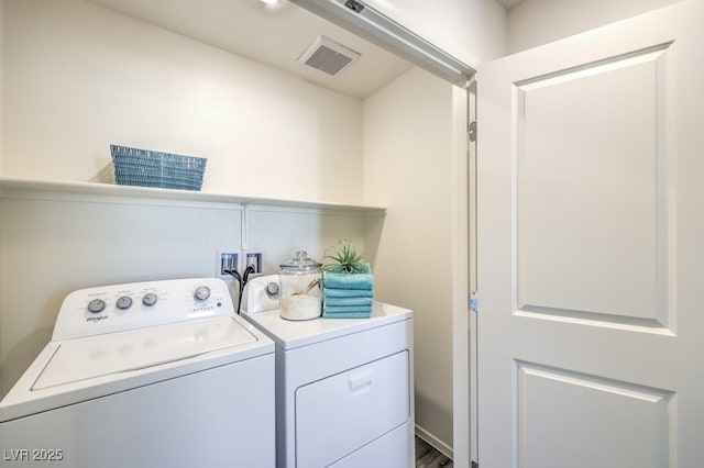 laundry room featuring separate washer and dryer, laundry area, and visible vents