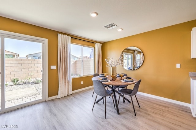 dining space featuring light wood-style floors, visible vents, baseboards, and recessed lighting