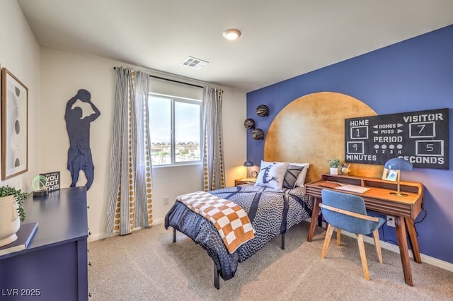 carpeted bedroom with baseboards and visible vents
