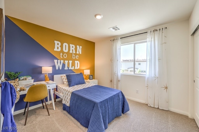 bedroom with carpet floors, baseboards, and visible vents