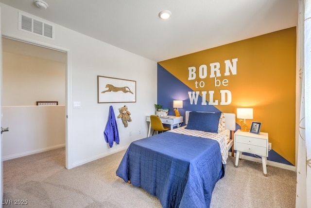 carpeted bedroom featuring baseboards and visible vents