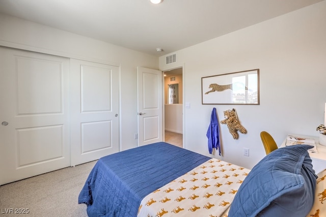 bedroom featuring carpet floors, a closet, and visible vents