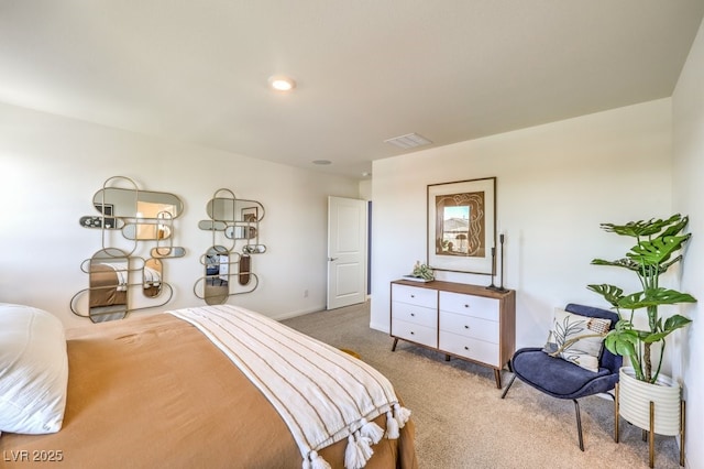 bedroom featuring baseboards, visible vents, and light colored carpet