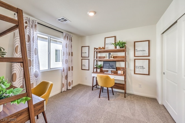 home office with light colored carpet, baseboards, and visible vents