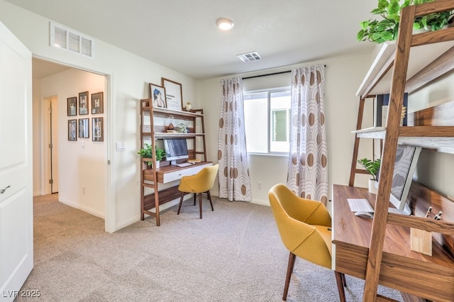 office space with carpet floors, baseboards, and visible vents