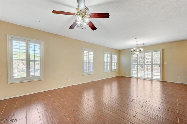 1158 Gecko Rd, Henderson, NV 89002 - unfurnished room featuring a chandelier, healthy amount of natural light, and ceiling fan
