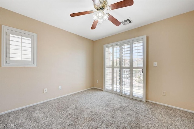 1158 Gecko Rd, Henderson, NV 89002 - empty room featuring healthy amount of natural light, carpet, a ceiling fan, and baseboards