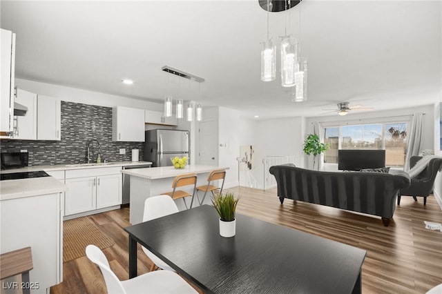 3208 Alcoa Ave, Las Vegas, NV 89102 - dining area featuring wood finished floors, a ceiling fan, and recessed lighting