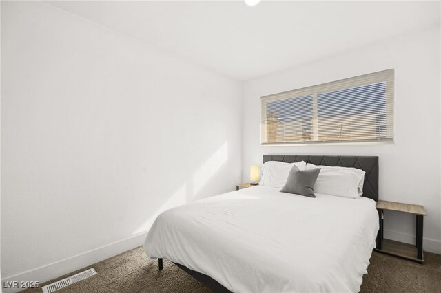3208 Alcoa Ave, Las Vegas, NV 89102 - bedroom with baseboards, carpet flooring, and visible vents