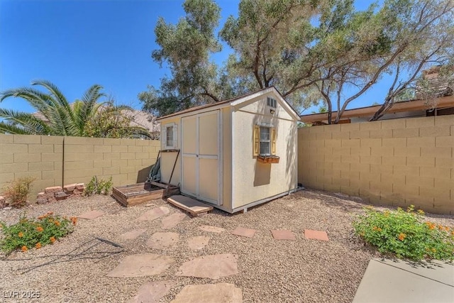 view of shed featuring a fenced backyard