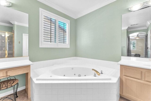 full bath featuring a shower stall, tile patterned flooring, vanity, crown molding, and a tub with jets