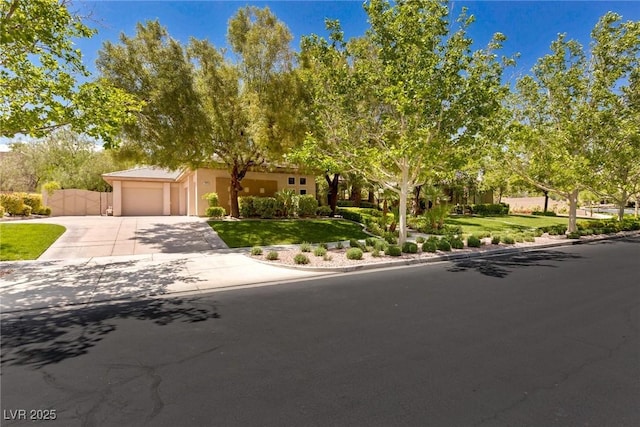 9713 Highridge Dr, Las Vegas, NV 89134 - view of front of property featuring concrete driveway, a garage, a front yard, and stucco siding