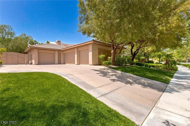9713 Highridge Dr, Las Vegas, NV 89134 - view of front facade with a garage, driveway, stucco siding, a front lawn, and a chimney