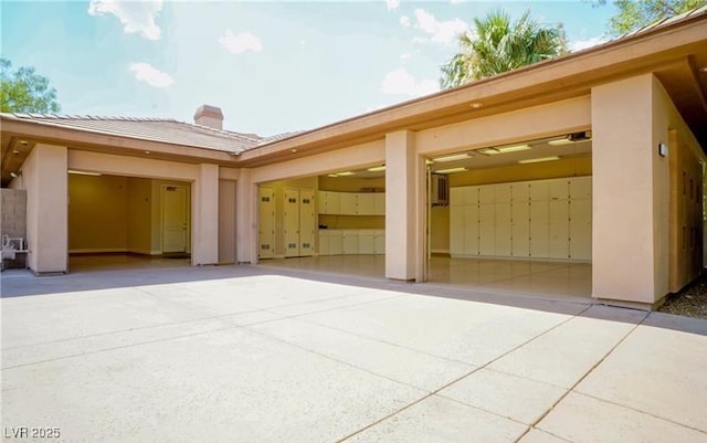 9713 Highridge Dr, Las Vegas, NV 89134 - view of patio / terrace with concrete driveway and an attached garage