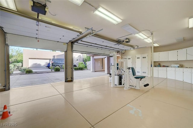 9713 Highridge Dr, Las Vegas, NV 89134 - garage featuring a garage door opener
