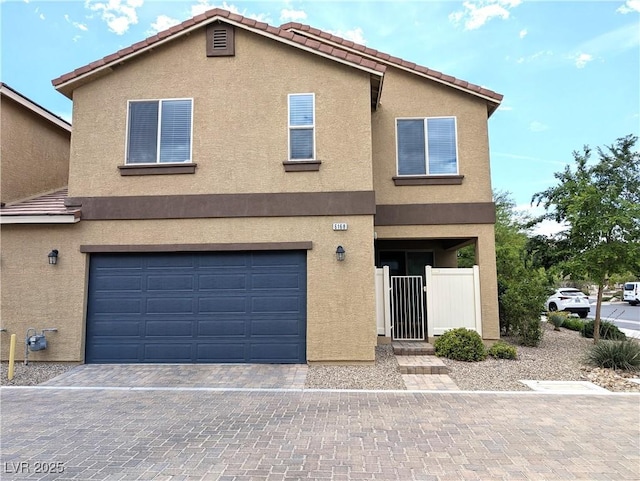 6168 Scarlet Leaf St, Las Vegas, NV 89148 - multi unit property featuring a tile roof, an attached garage, stucco siding, and decorative driveway