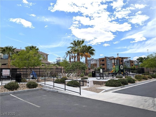 6168 Scarlet Leaf St, Las Vegas, NV 89148 - view of street with curbs, a residential view, and street lights