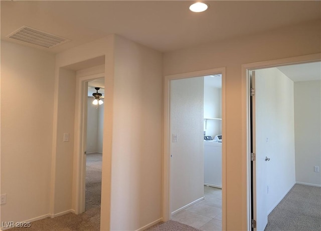 6168 Scarlet Leaf St, Las Vegas, NV 89148 - hall with washing machine and clothes dryer, light colored carpet, baseboards, and recessed lighting