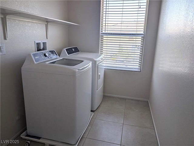 6168 Scarlet Leaf St, Las Vegas, NV 89148 - laundry room with separate washer and dryer, light tile patterned floors, and baseboards