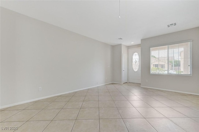 entryway with visible vents, baseboards, and light tile patterned flooring