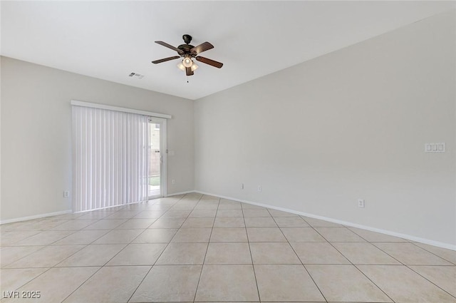 empty room with light tile patterned floors, visible vents, baseboards, and a ceiling fan