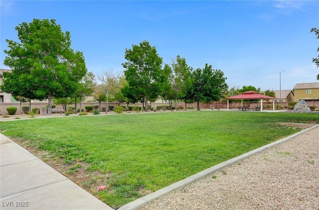 view of yard featuring fence and a gazebo
