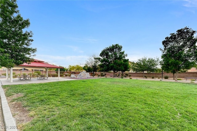 view of yard featuring a patio, a gazebo, and fence