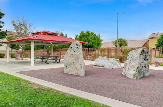 view of play area with a gazebo, a patio area, and fence