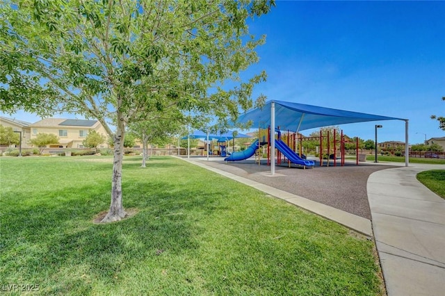 community jungle gym featuring a yard