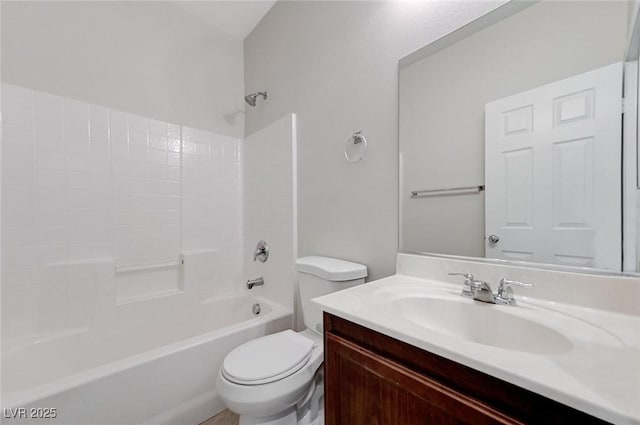 bathroom featuring toilet, vanity, and shower / bathtub combination