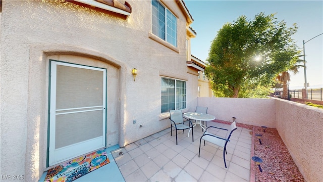 view of patio with outdoor dining area and a fenced backyard