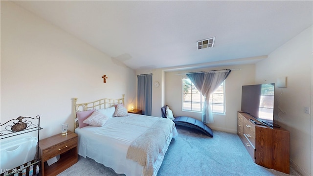 bedroom with carpet flooring, baseboards, and visible vents