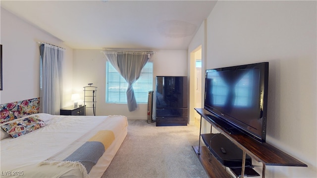 carpeted bedroom featuring baseboards