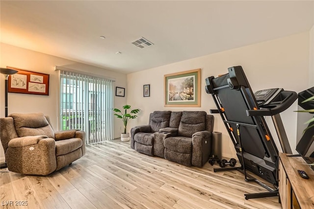 sitting room featuring visible vents and light wood-style floors