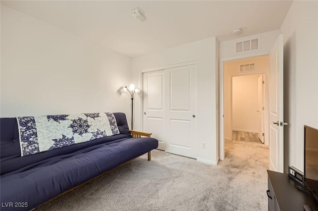 carpeted living room with baseboards and visible vents