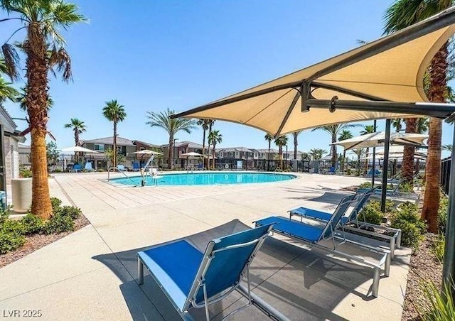 community pool with a patio