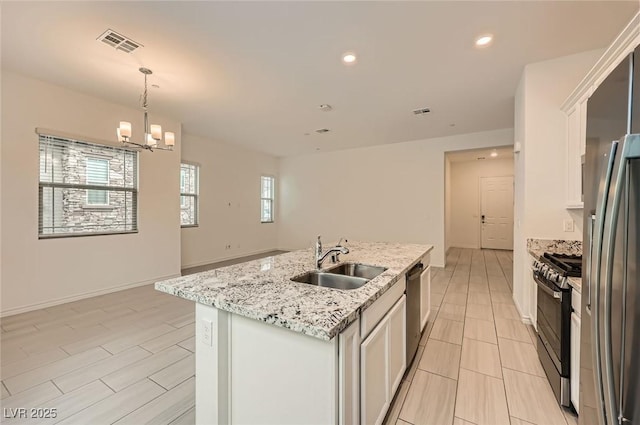 790 Sunny Sagebrush St, Henderson, NV 89011 - kitchen with a sink, stainless steel appliances, a center island with sink, visible vents, and a chandelier