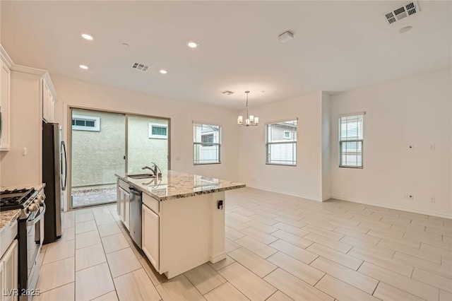 790 Sunny Sagebrush St, Henderson, NV 89011 - kitchen featuring a notable chandelier, visible vents, appliances with stainless steel finishes, and a sink