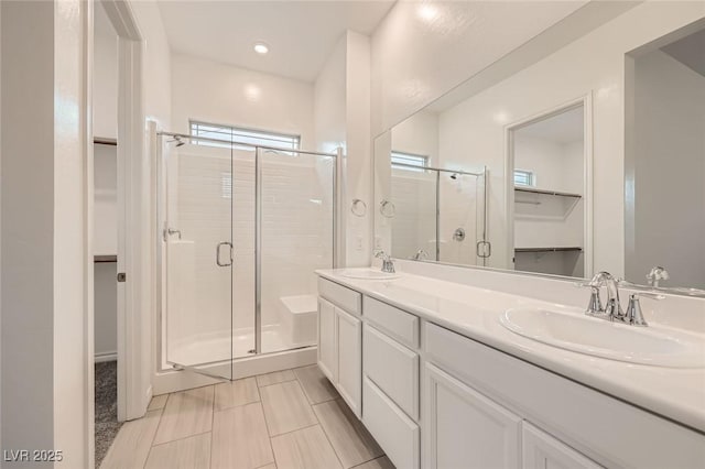 790 Sunny Sagebrush St, Henderson, NV 89011 - full bath featuring a shower stall, double vanity, a sink, and a walk in closet