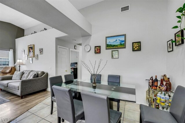 dining room with visible vents and light tile patterned flooring