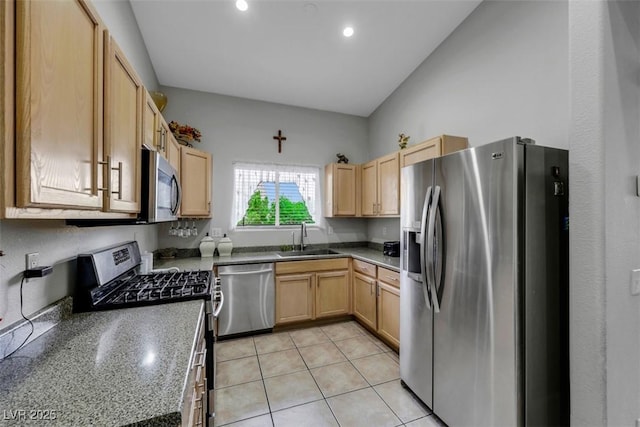 kitchen with recessed lighting, light brown cabinetry, appliances with stainless steel finishes, and a sink