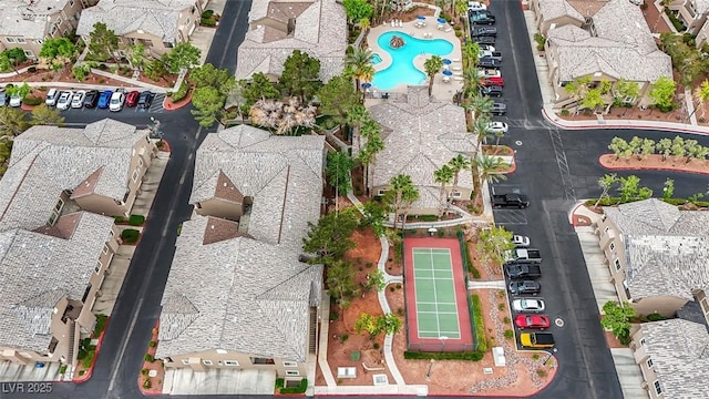 birds eye view of property with a residential view