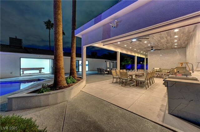 view of patio / terrace with outdoor dining space, an outdoor pool, and a ceiling fan